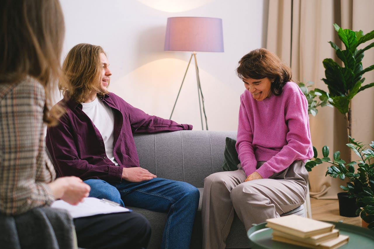 A cozy therapy session indoors with attentive participants.